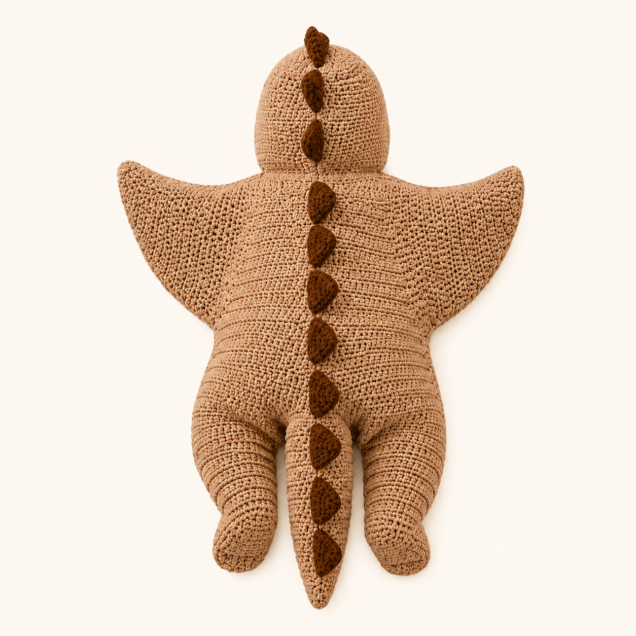 Close-up of crochet dinosaur hood with soft spikes and teeth detail